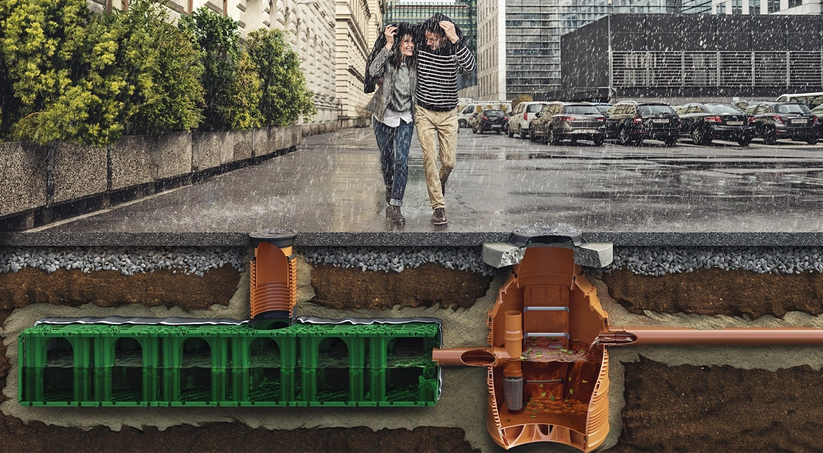 Animation: Couple walking in the rain, cross-section showing the drainage system beneath the street (photo)